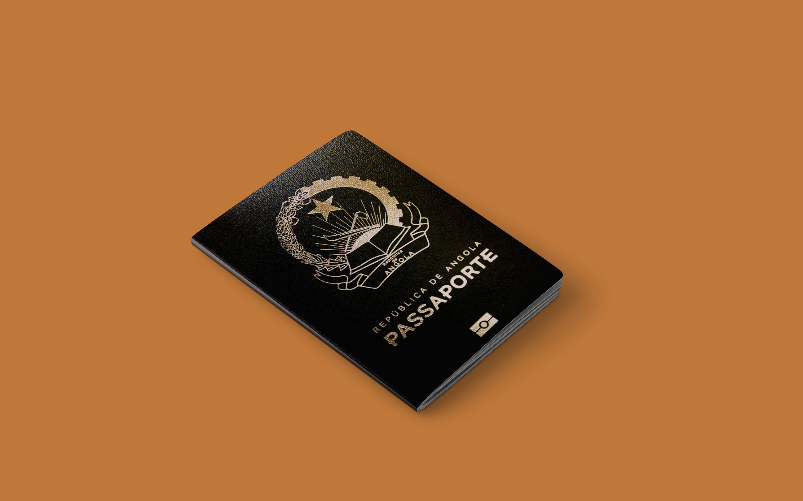 Angolan passport on a brown background