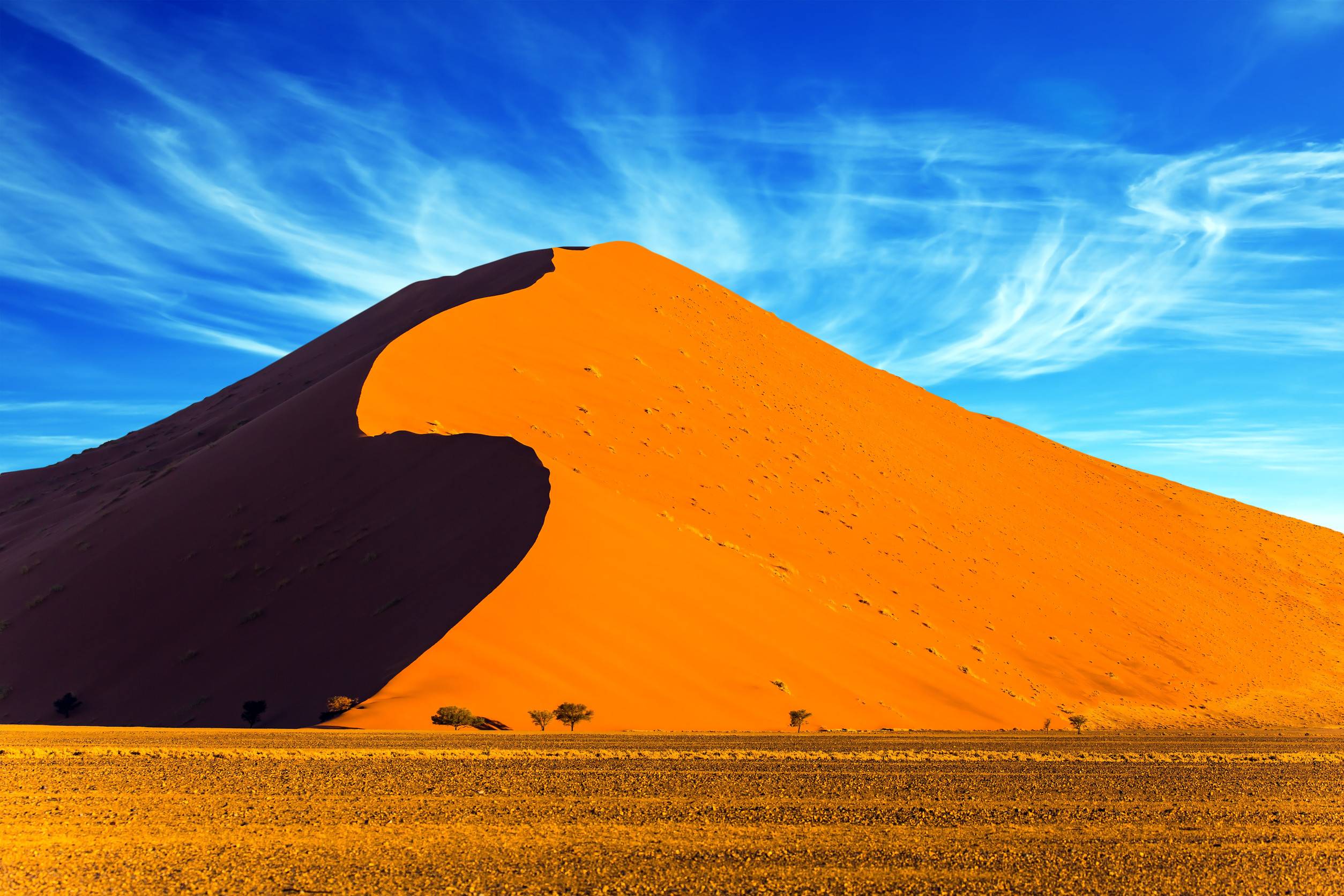 Golden Sand Dune Under Blue Sky