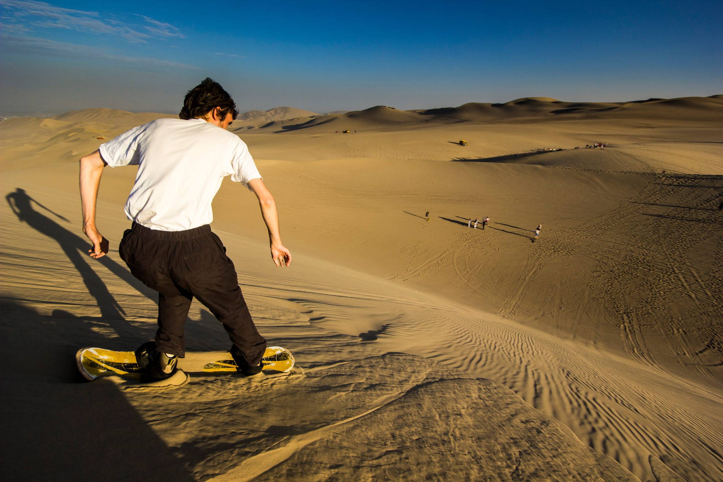 Sandboarding during sunset